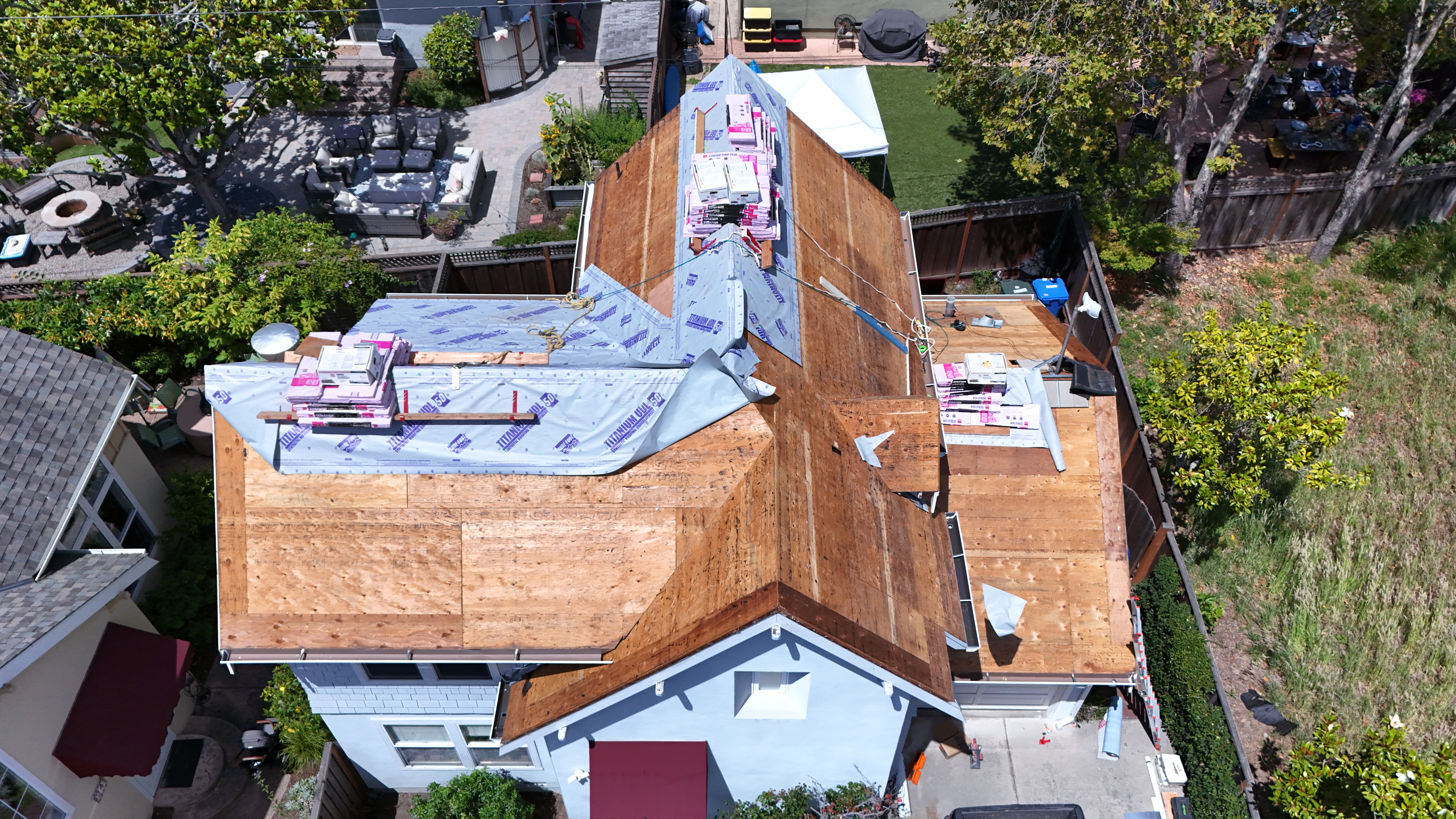 Roof deck and underlayment mid-installation from above